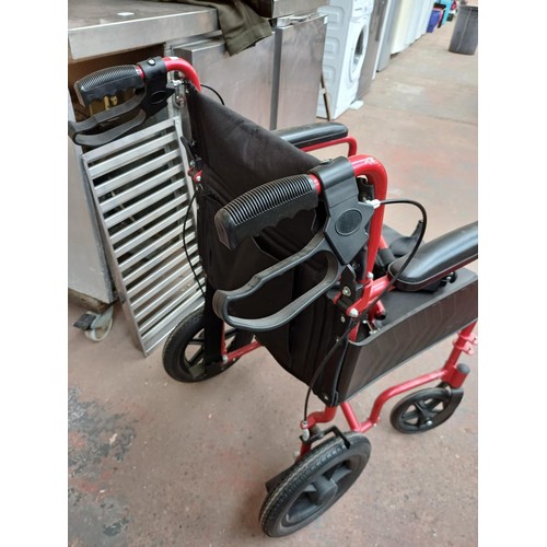 868 - A Karma mobility limited folding wheelchair with footrests