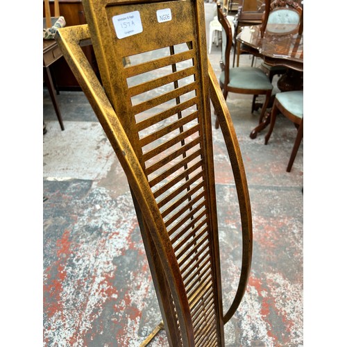 157A - A gilt metal freestanding CD rack - approx. 136cm high