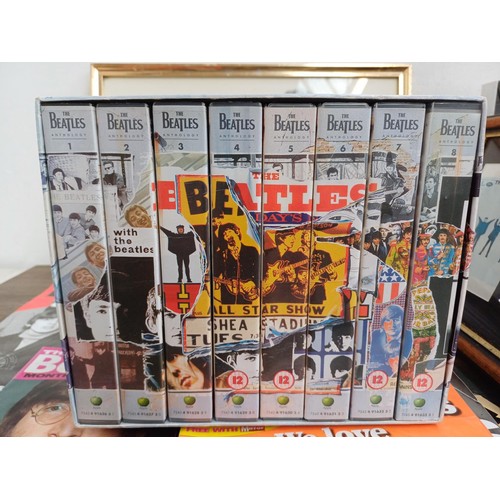 737 - A collection of The Beatles memorabilia and media to include framed print, Abbey Road LP, books, DVD... 