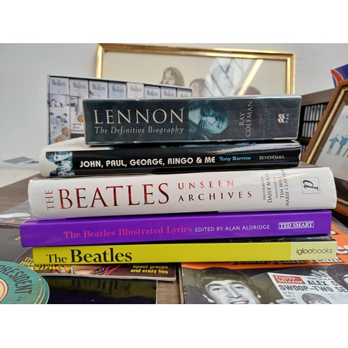 737 - A collection of The Beatles memorabilia and media to include framed print, Abbey Road LP, books, DVD... 