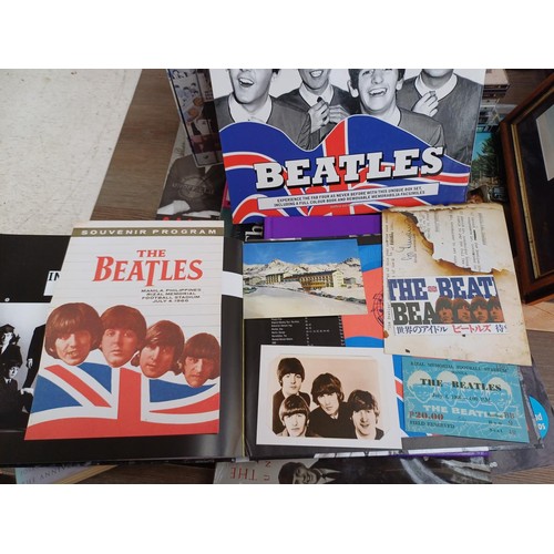 737 - A collection of The Beatles memorabilia and media to include framed print, Abbey Road LP, books, DVD... 