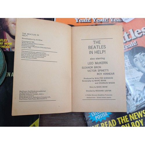 737 - A collection of The Beatles memorabilia and media to include framed print, Abbey Road LP, books, DVD... 