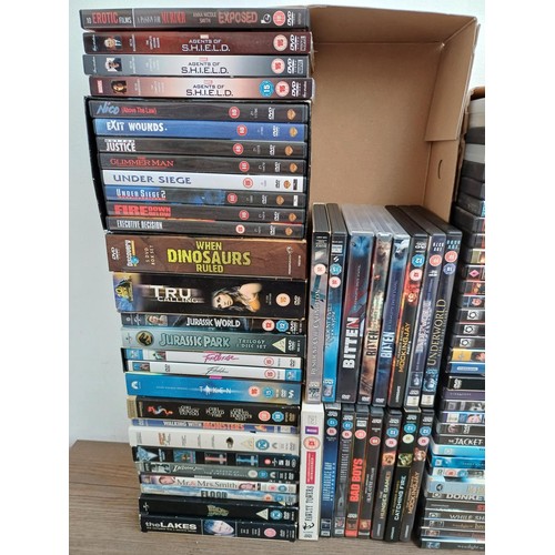 746 - Five boxes containing a collection of DVDs to include Good Night Sweetheart, Bad Boys, Bitten, Juras... 