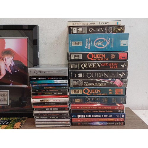 755 - A very large collection of Queen and Freddie Mercury CDs, DVDs, book, badges VHS videos, 7