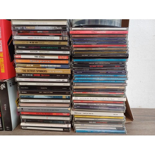 756 - Two boxes containing a collection of CD singles and albums to include Genesis, The Who, Buddy Holly,... 