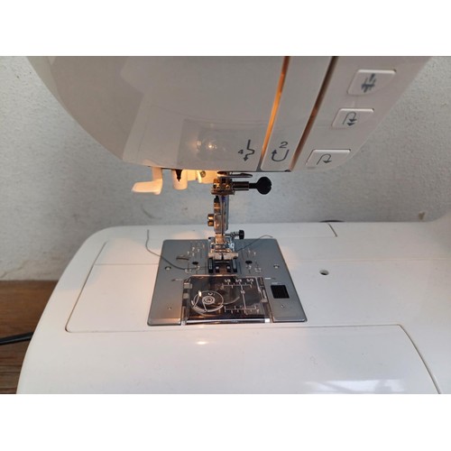 827 - A cased Elma 5300 fifty stitch electric sewing machine with foot pedal and power cable