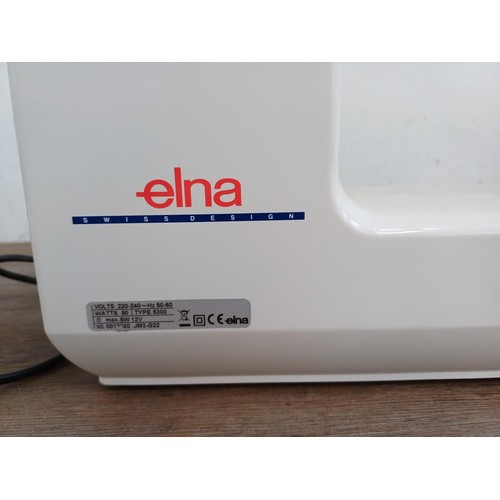 827 - A cased Elma 5300 fifty stitch electric sewing machine with foot pedal and power cable