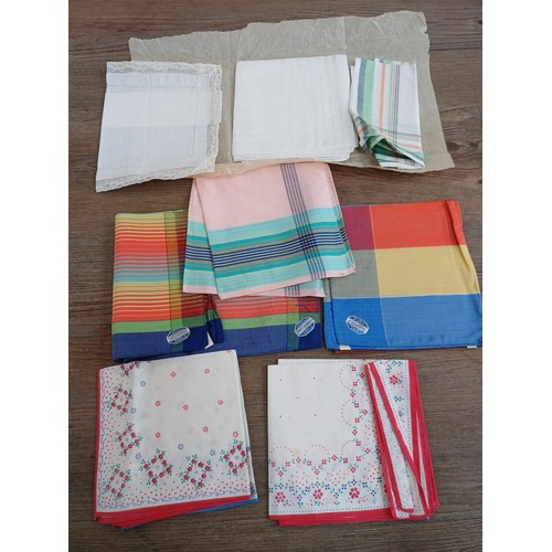 834 - A box containing vintage fabrics, pinnies and handkerchiefs