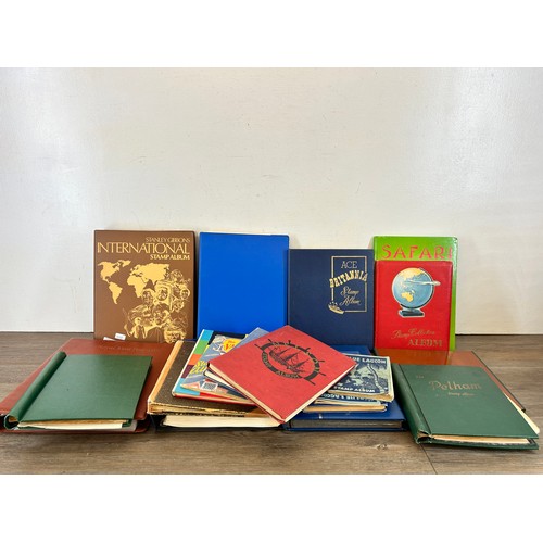 593A - Nineteen stamp albums containing antique and later world wide stamps