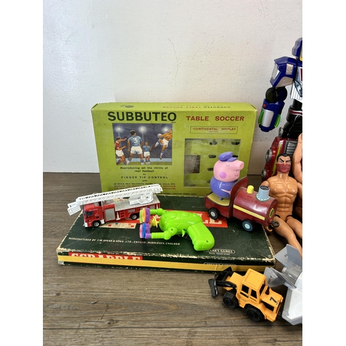 483 - A collection of toys and games to include vintage Subbuteo table football set, Action Man figurines,... 