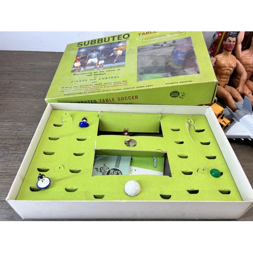 483 - A collection of toys and games to include vintage Subbuteo table football set, Action Man figurines,... 