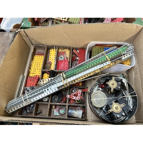 495 - Four boxes containing a large collection of vintage Meccano construction accessories