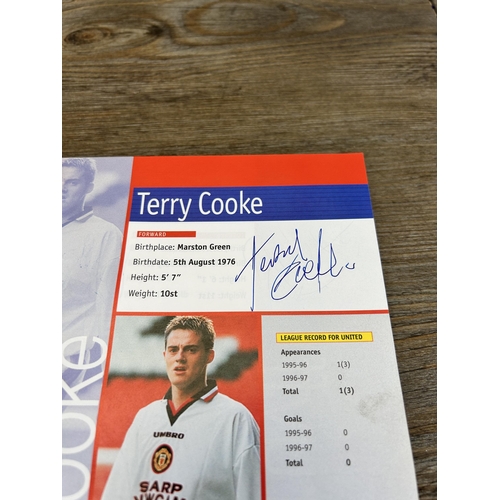 572 - A collection of 1990s Manchester United official programmes together with a signed official year boo... 