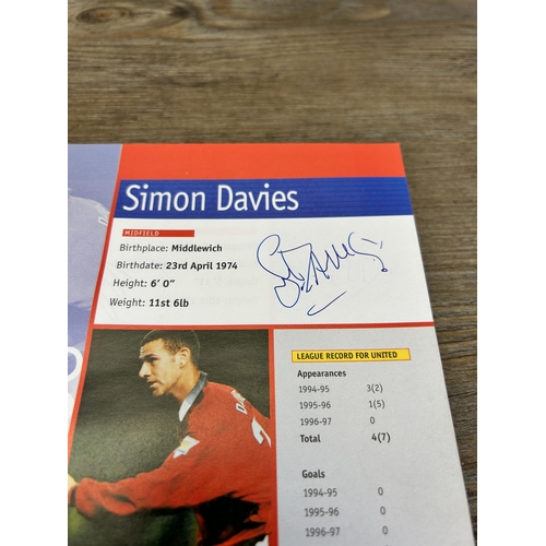 572 - A collection of 1990s Manchester United official programmes together with a signed official year boo... 