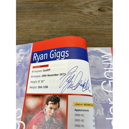 572 - A collection of 1990s Manchester United official programmes together with a signed official year boo... 