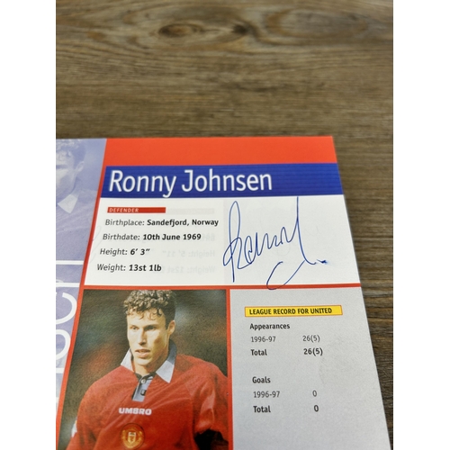 572 - A collection of 1990s Manchester United official programmes together with a signed official year boo... 