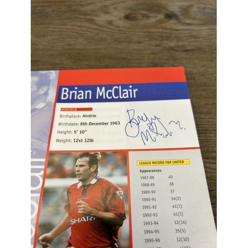 572 - A collection of 1990s Manchester United official programmes together with a signed official year boo... 