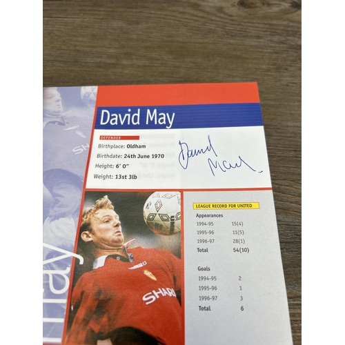 572 - A collection of 1990s Manchester United official programmes together with a signed official year boo... 