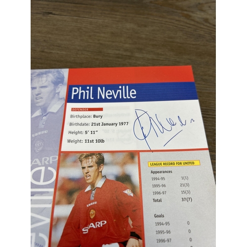 572 - A collection of 1990s Manchester United official programmes together with a signed official year boo... 