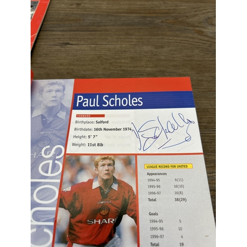 572 - A collection of 1990s Manchester United official programmes together with a signed official year boo... 