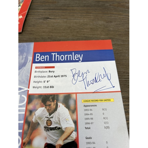 572 - A collection of 1990s Manchester United official programmes together with a signed official year boo... 