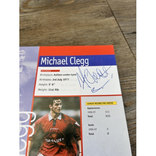 572 - A collection of 1990s Manchester United official programmes together with a signed official year boo... 