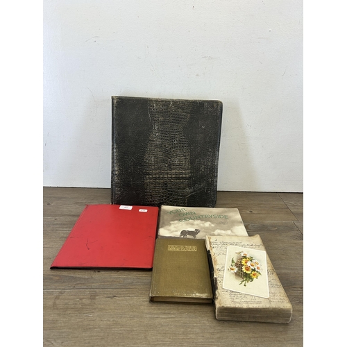 579 - A collection of antique and later items to include crocodile skin postcard album containing 19th cen... 