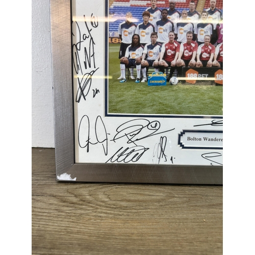 584 - A framed and signed Bolton Wanderers F.C. 2011-2012 photograph - approx. 32cm high x 42cm wide