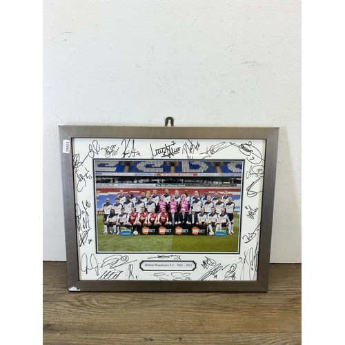 584 - A framed and signed Bolton Wanderers F.C. 2011-2012 photograph - approx. 32cm high x 42cm wide