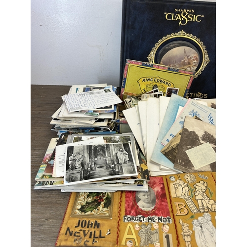 587 - A large collection of vintage postcards and picture cards together with four Victorian portrait phot... 