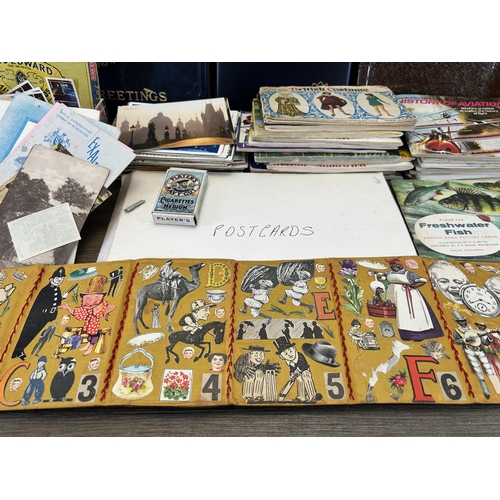 587 - A large collection of vintage postcards and picture cards together with four Victorian portrait phot... 