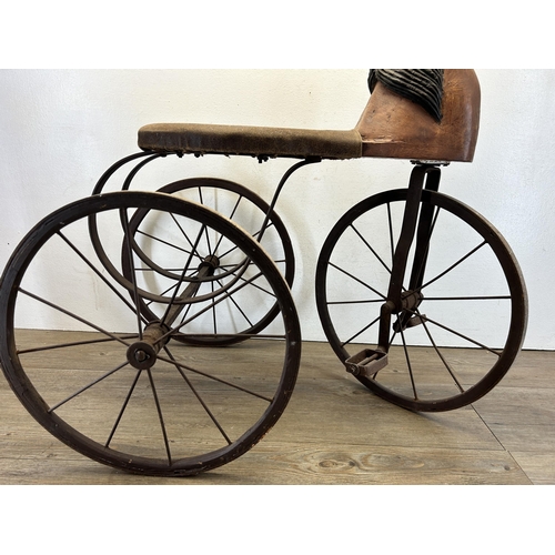 641 - An early/mid 20th century French carved hardwood and metal pedal horse tricycle/velocipede - approx.... 