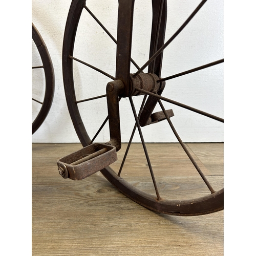 641 - An early/mid 20th century French carved hardwood and metal pedal horse tricycle/velocipede - approx.... 