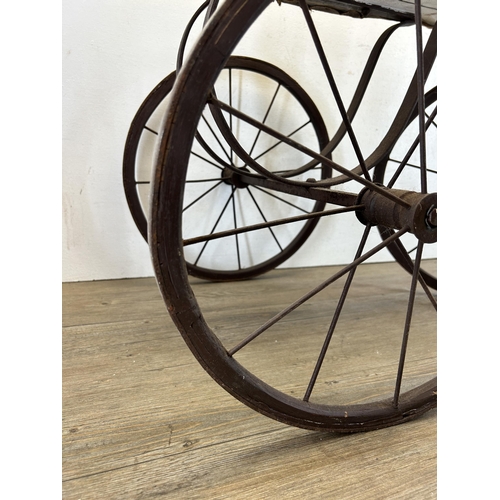 641 - An early/mid 20th century French carved hardwood and metal pedal horse tricycle/velocipede - approx.... 