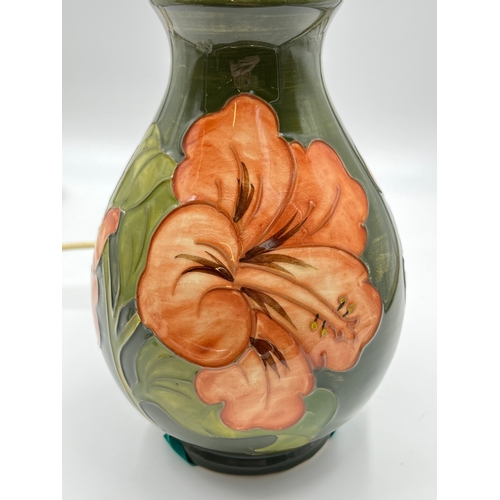 295 - A Moorcroft Coral Hibiscus pattern table lamp - approx. 26cm high