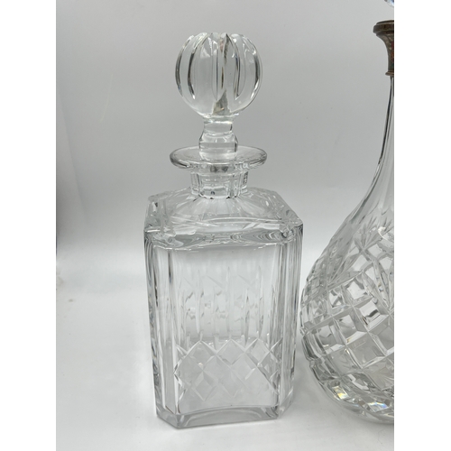 320 - Three cut glass decanters to include Edinburgh Crystal, hallmarked Birmingham silver collared etc. -... 