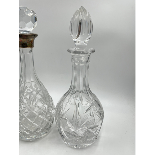 320 - Three cut glass decanters to include Edinburgh Crystal, hallmarked Birmingham silver collared etc. -... 