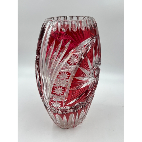 321 - A Bohemian ruby red cut glass vase - approx. 26cm high