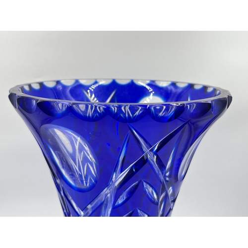 322 - A Bohemian blue cut glass trumpet vase - approx. 30cm high