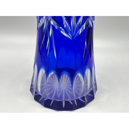 322 - A Bohemian blue cut glass trumpet vase - approx. 30cm high