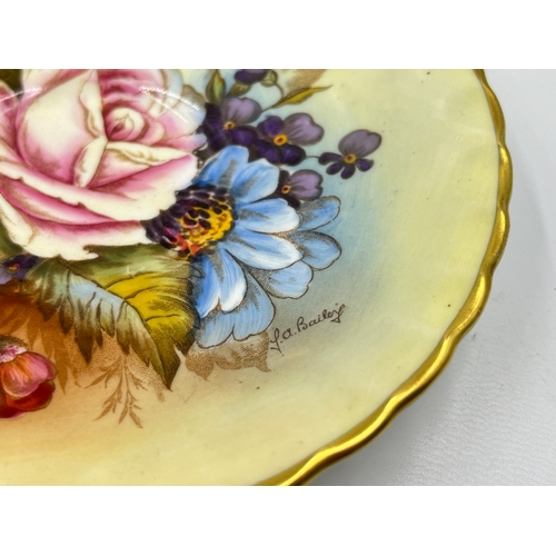 324 - An Aynsley hand painted floral pattern saucer by J. A. Bailey - approx. 14cm diameter