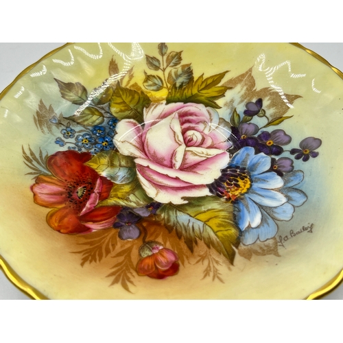 324 - An Aynsley hand painted floral pattern saucer by J. A. Bailey - approx. 14cm diameter