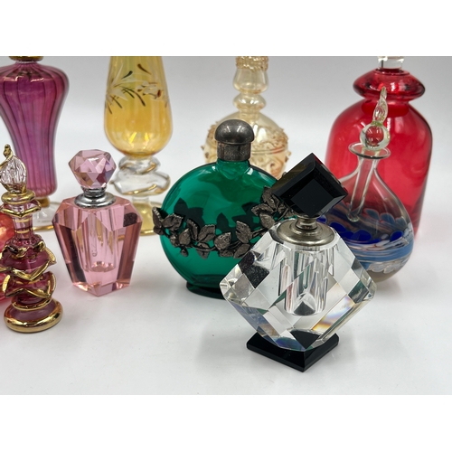 325 - Twelve glass scent bottles - largest approx. 23cm high