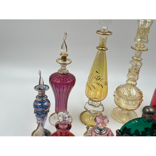 325 - Twelve glass scent bottles - largest approx. 23cm high