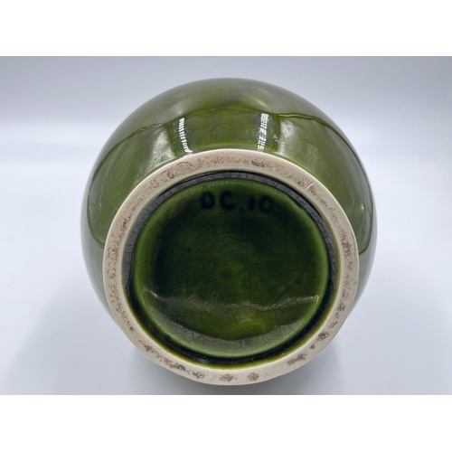 330 - A mid 20th century green drip glazed studio pottery vase, stamped DC10 - approx. 31cm high