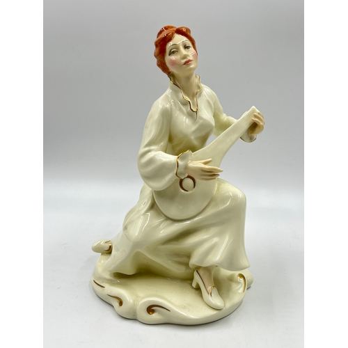 334 - A Royal Doulton The Enchantment Collection Serenade ivory bone china figurine, modelled by Eric Grif... 