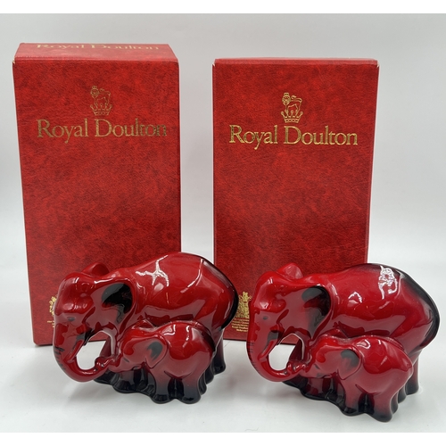 337 - Two boxed Royal Doulton Flambé Elephant and Young figurines - HN 3548