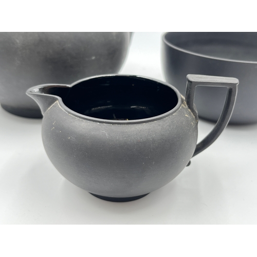 338 - A Wedgwood black basalt three piece tea set