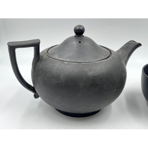 338 - A Wedgwood black basalt three piece tea set