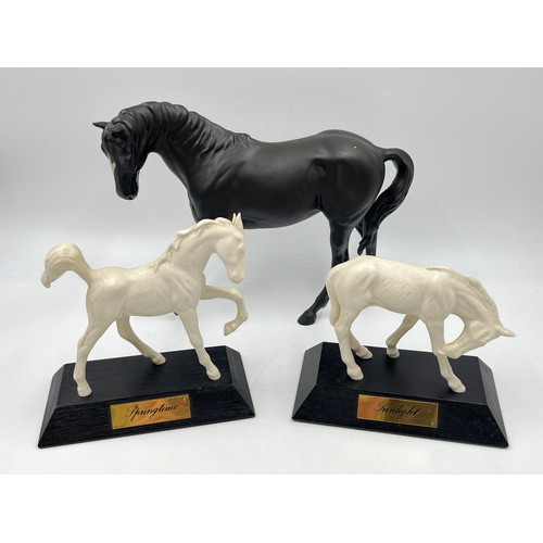 345 - Three ceramic horse figurines, Beswick Springtime, Beswick Sunlight and Royal Doulton Black Beauty